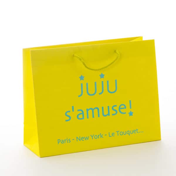 un sac kraft de luxe couleur jaune pour juju s'amuse